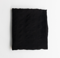 Black fabric on a white background