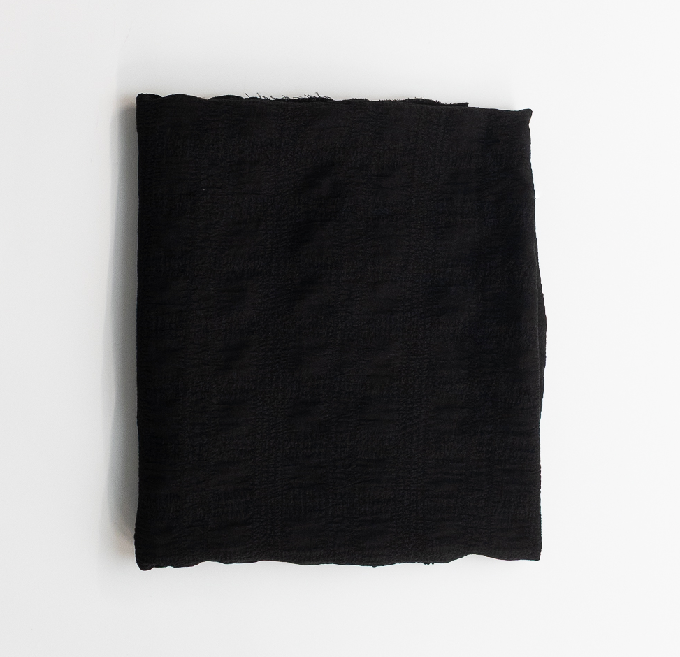 Black fabric on a white background