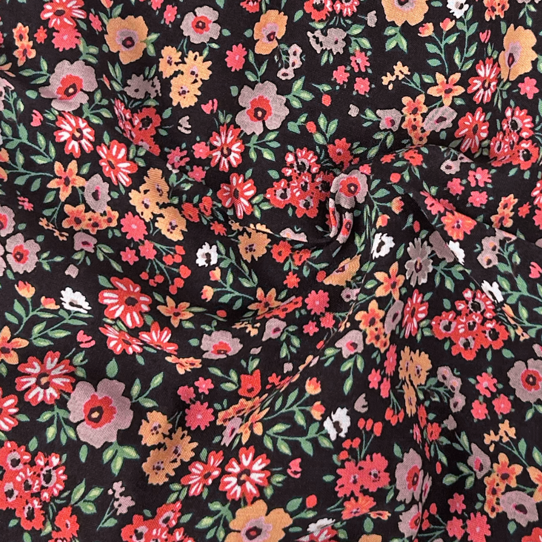 Floral pattern fabric with colorful flowers on a black background