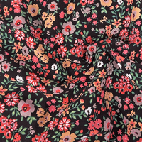 Floral pattern fabric with colorful flowers on a black background