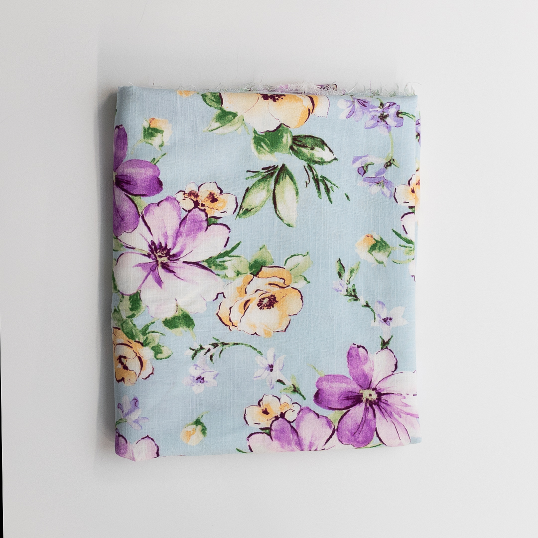 Floral-patterned fabric on a light blue background