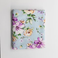 Floral-patterned fabric on a light blue background