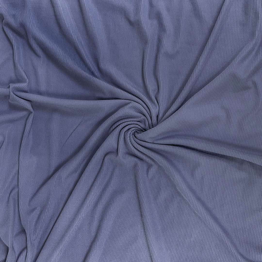 Close-up of blue fabric with a swirl pattern