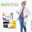Woman holding a coffee cup with sewing supplies and 'Greenstyle' branding.