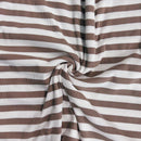Brown and white striped rib knit fabric in a swirl pattern