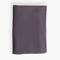 Folded purple fabric on a white background