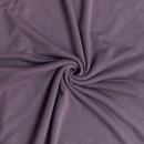 Close-up of purple french terry fabric with a swirl pattern