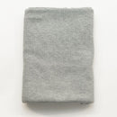 Folded gray fabric on a white background