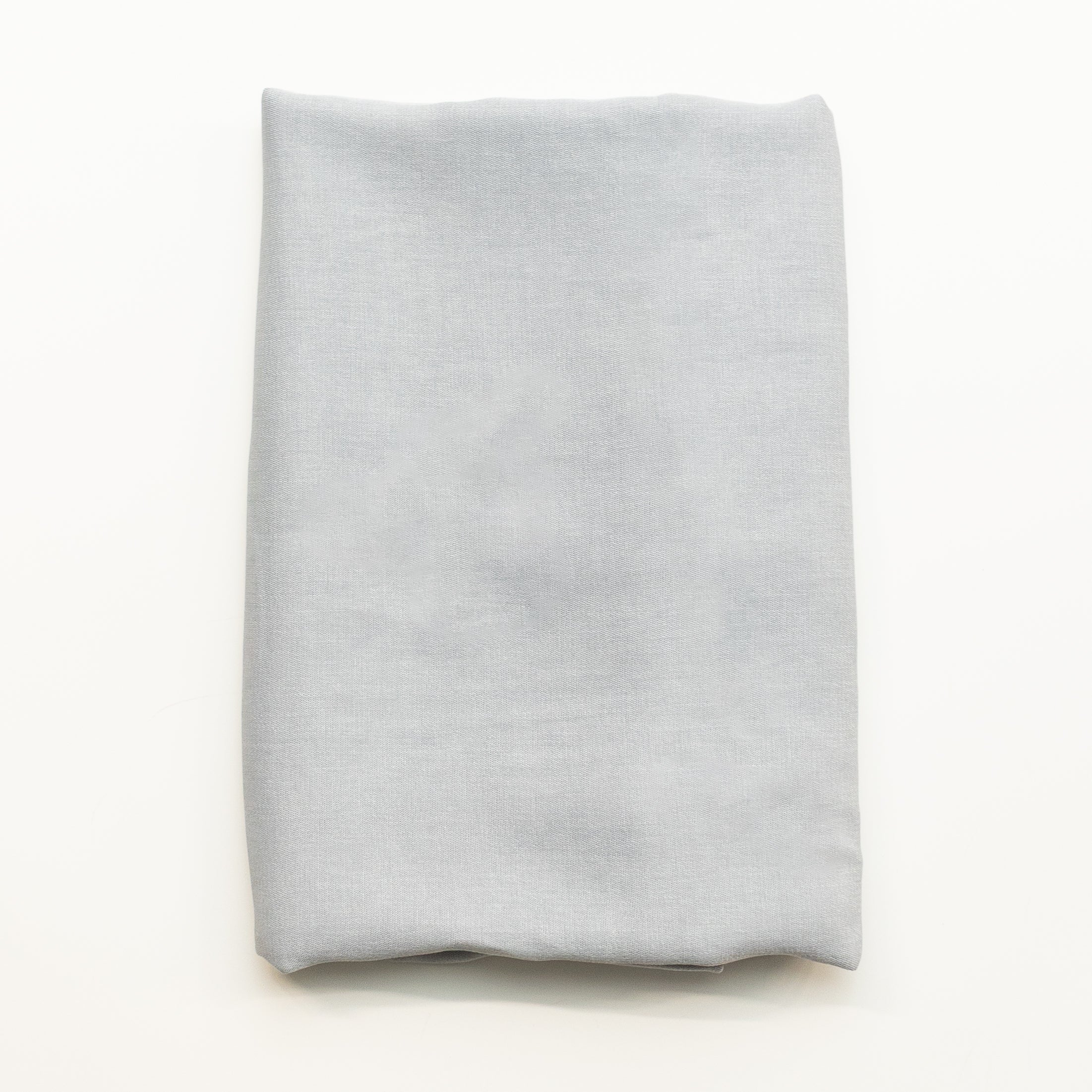 A folded piece of gray viscose fabric displayed flat against a clean white background.