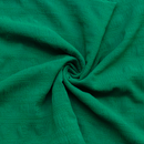 Close-up of check textured kelly green fabric with a swirl pattern