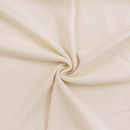 Close-up of beige ribbed fabric with a swirl pattern