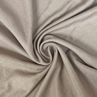 Close-up of beige fabric with a swirl pattern