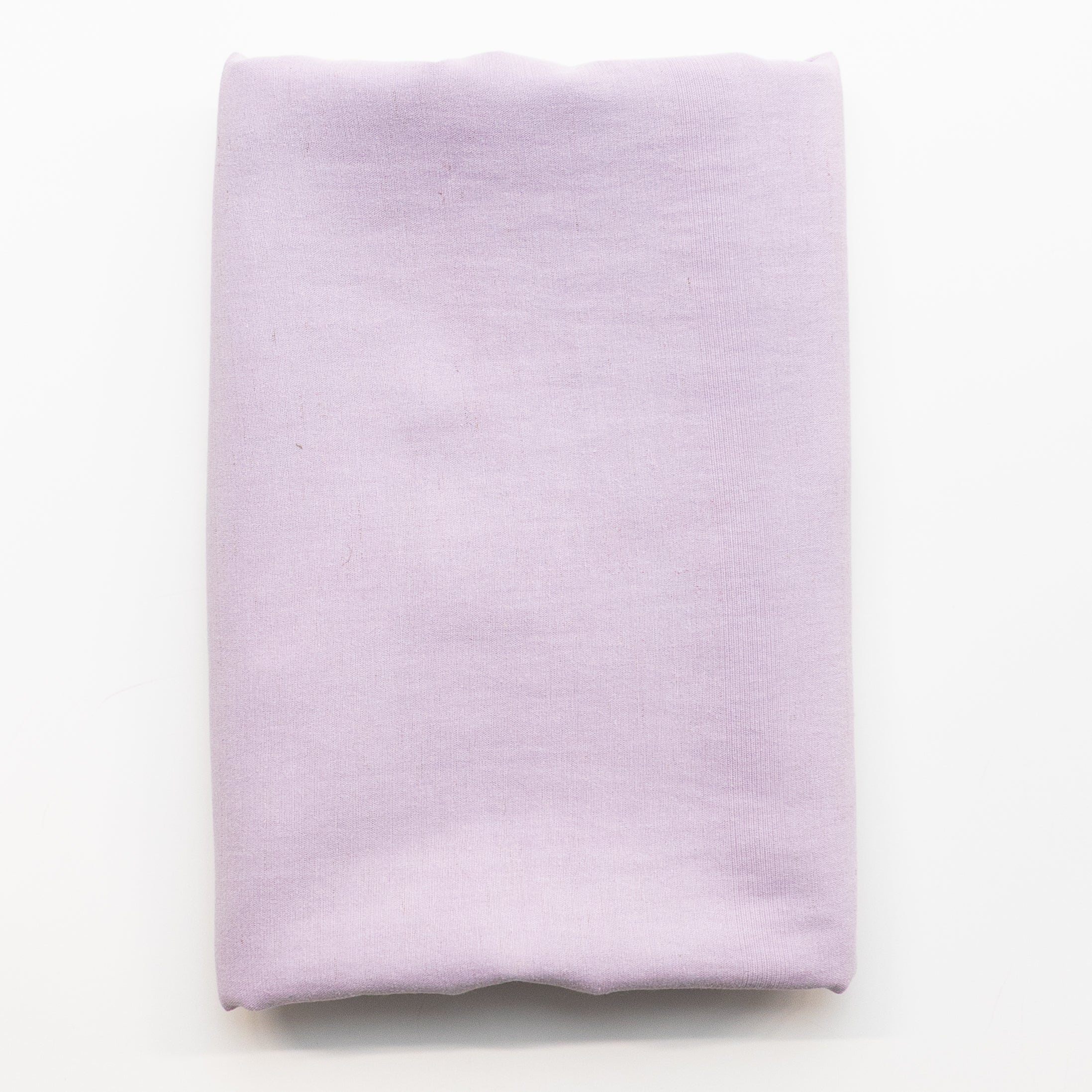 A folded piece of light lavender purple fabric displayed flat against a clean white background.