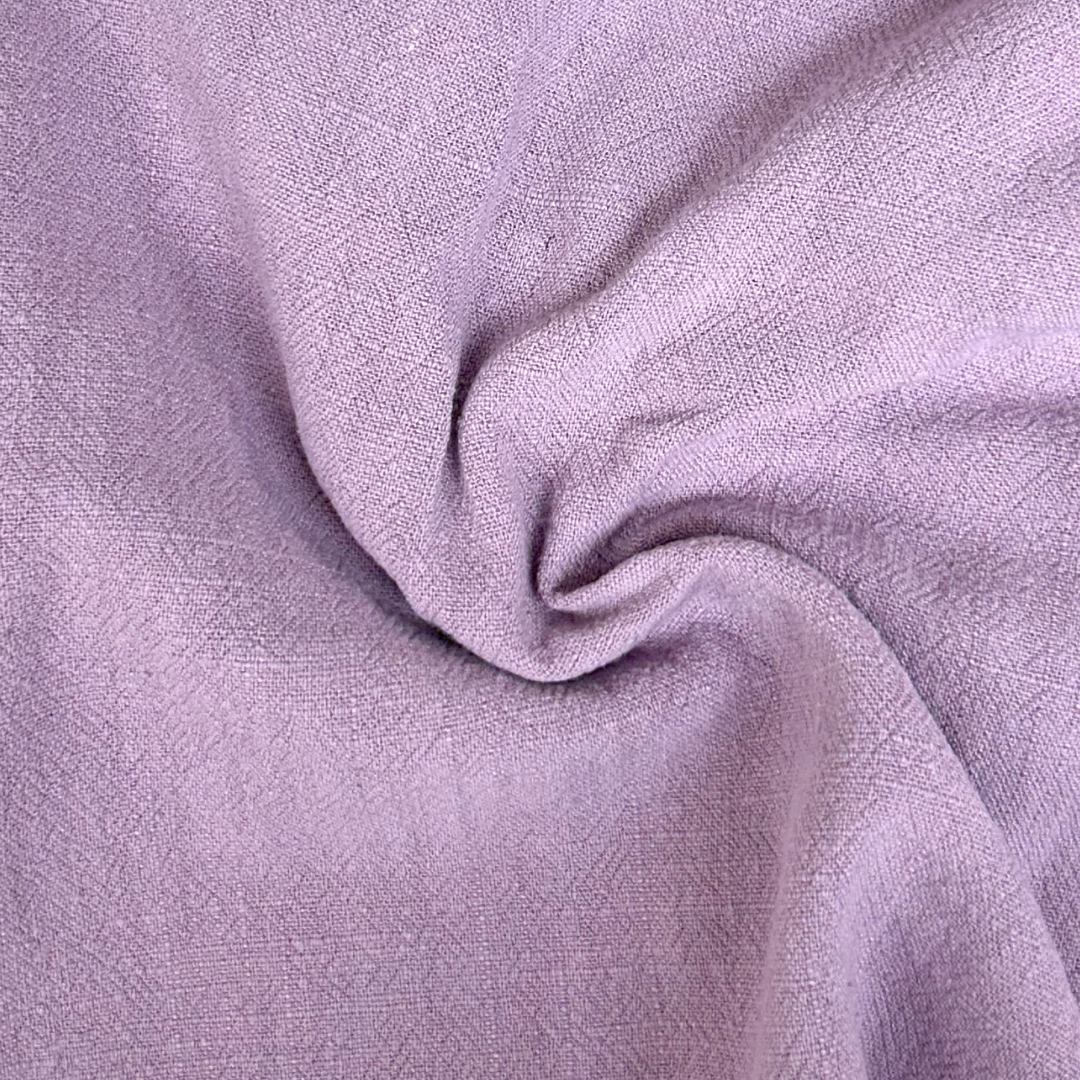 Close-up of purple fabric with a textured pattern