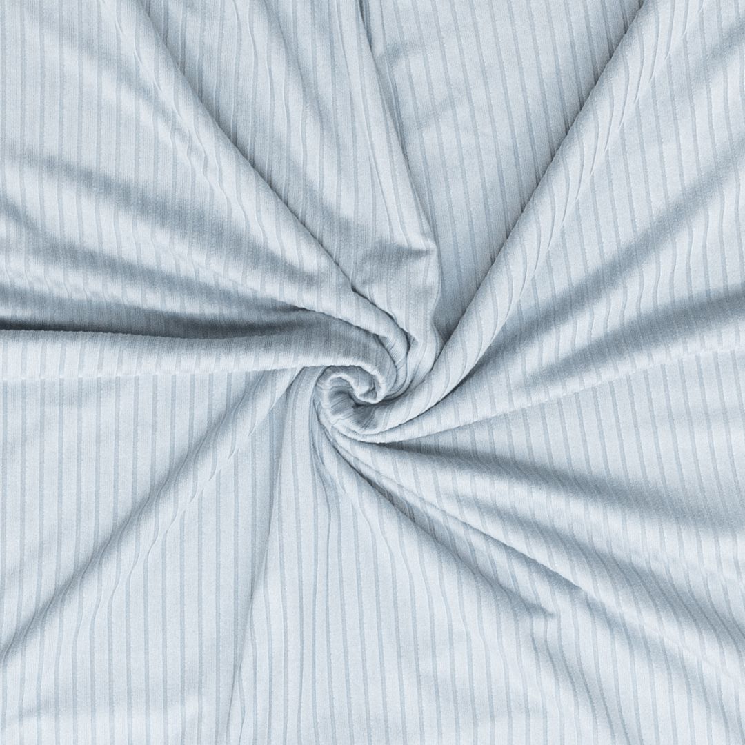 Close-up of light blue fabric with subtle pattern