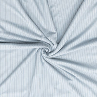 Close-up of light blue fabric with subtle pattern