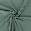 Close-up of green fabric with a swirl pattern