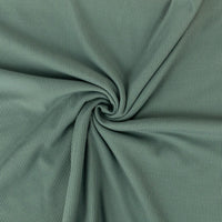 Close-up of green fabric with a swirl pattern