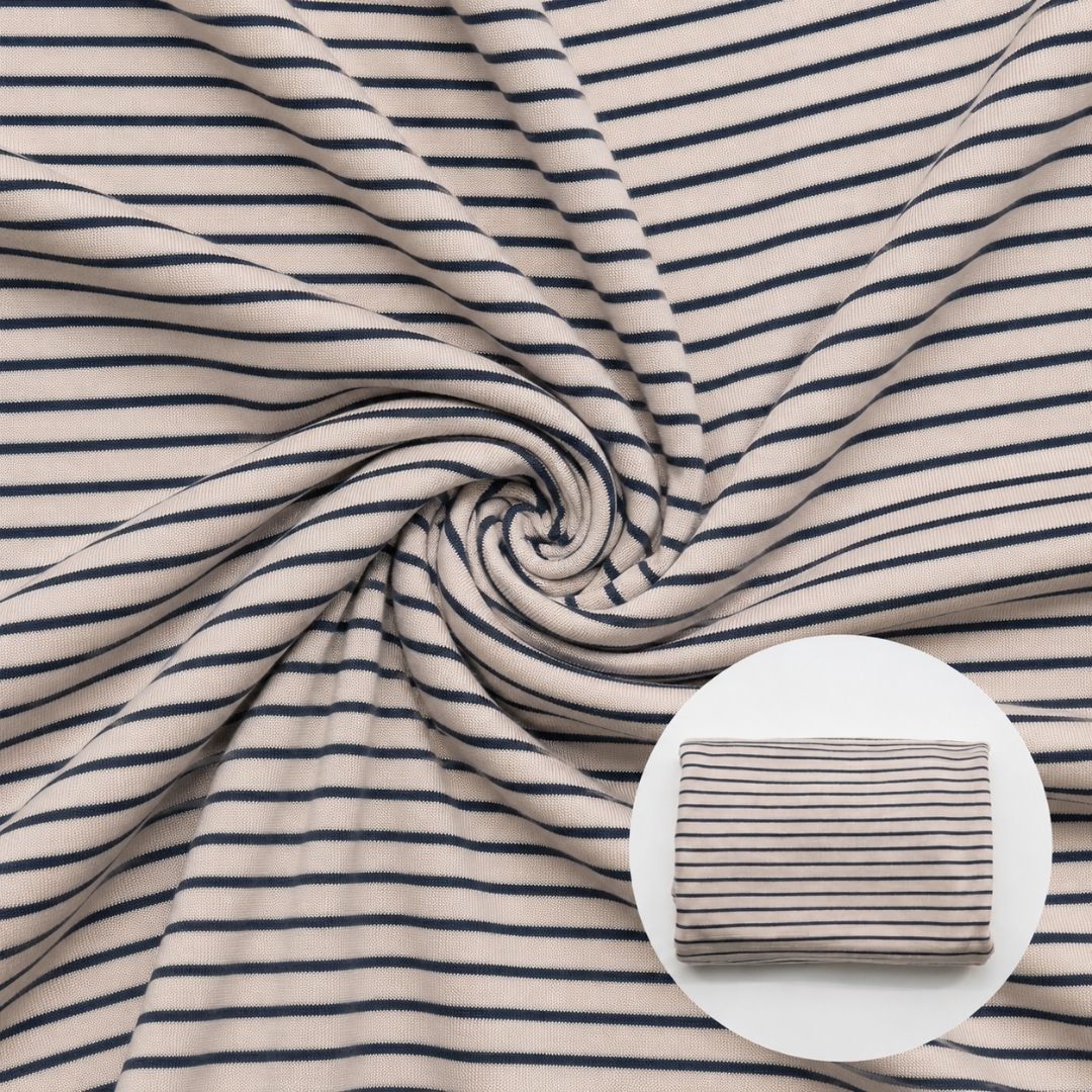 Closeup of ivory striped fabric in swirl pattern