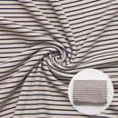 Closeup of ivory striped fabric in swirl pattern
