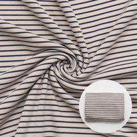 Closeup of ivory striped fabric in swirl pattern