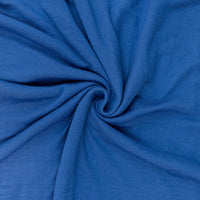 Close-up of blue sweater fabric in a swirl pattern