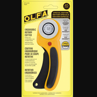OLFA rotary cutter on a yellow packaging background