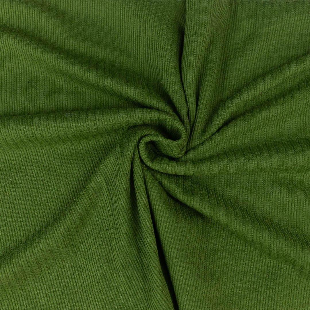 Close-up of green fabric with a swirl pattern