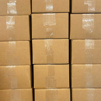 Stacked cardboard shipping boxes for fabric scrap packs