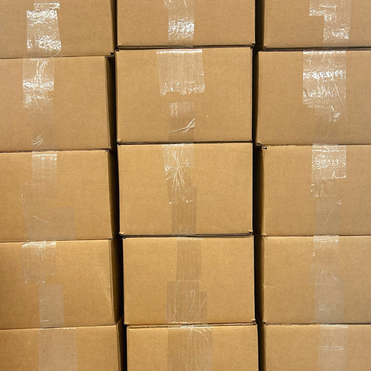 Stacked cardboard shipping boxes for fabric scrap packs