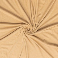 Close-up of beige fabric with a swirl pattern