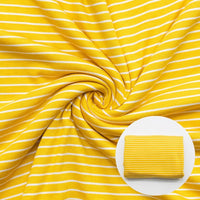 Close up of yellow stripe fabric in swirl pattern