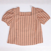 A bright orange sleeveless top featuring a square neckline and vertical line texture, laid flat on a clean white background.