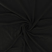 Close-up of black fabric with a swirl pattern