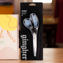 Gingher scissors in packaging on a wooden table
