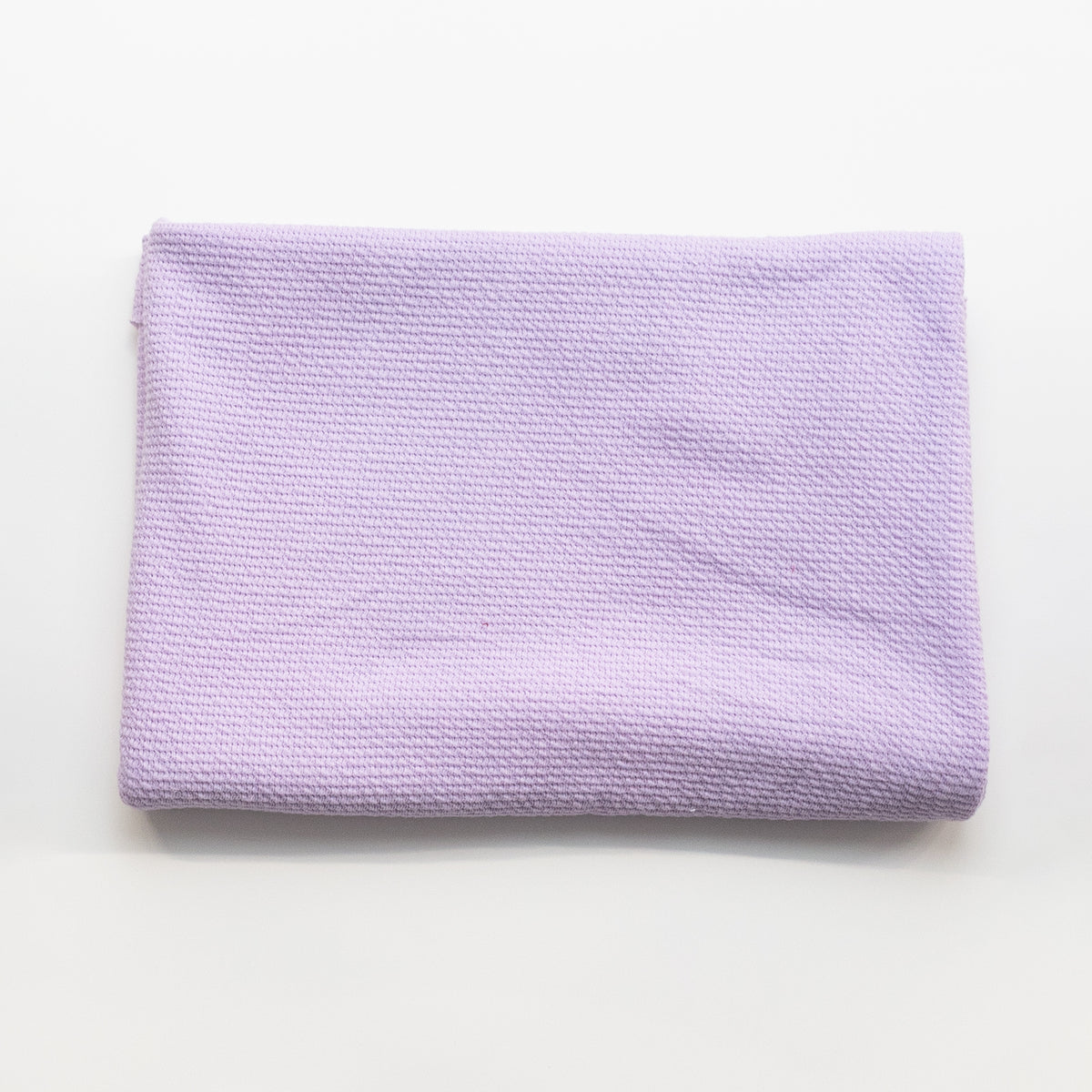 Lilac textured knit fabric, folded