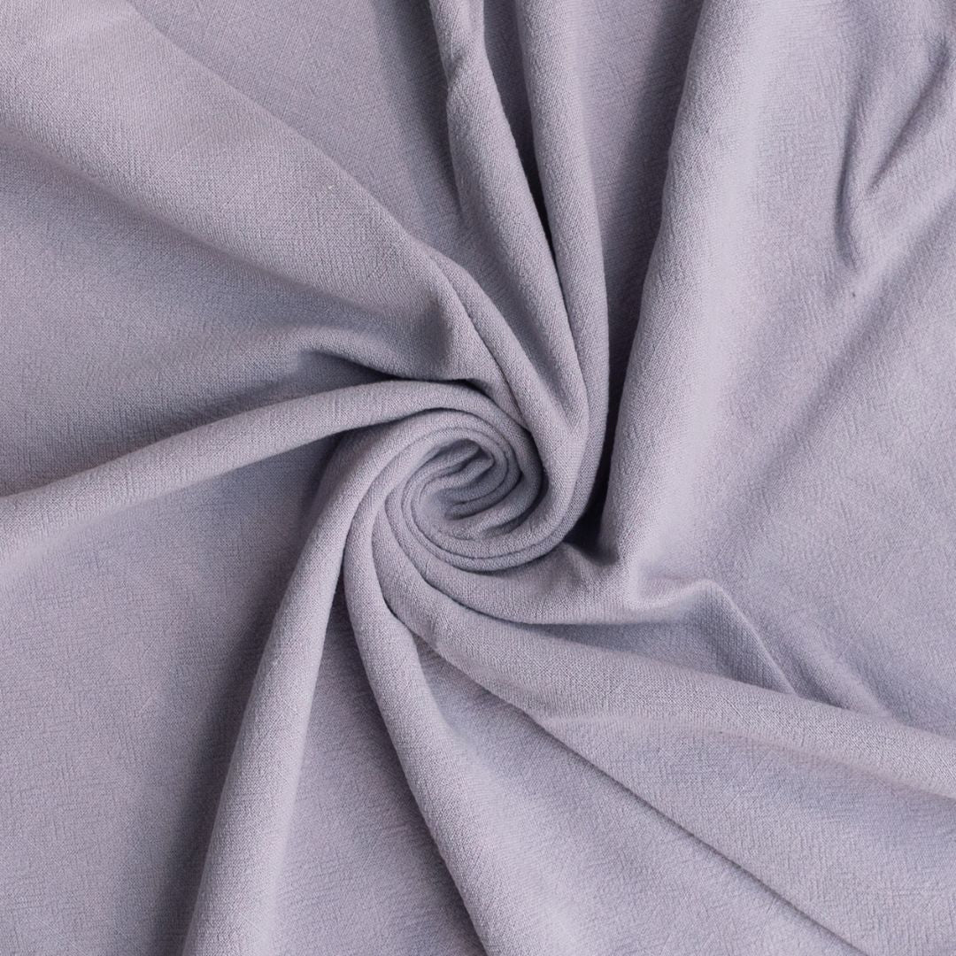 Close-up of gray fabric with a swirl pattern