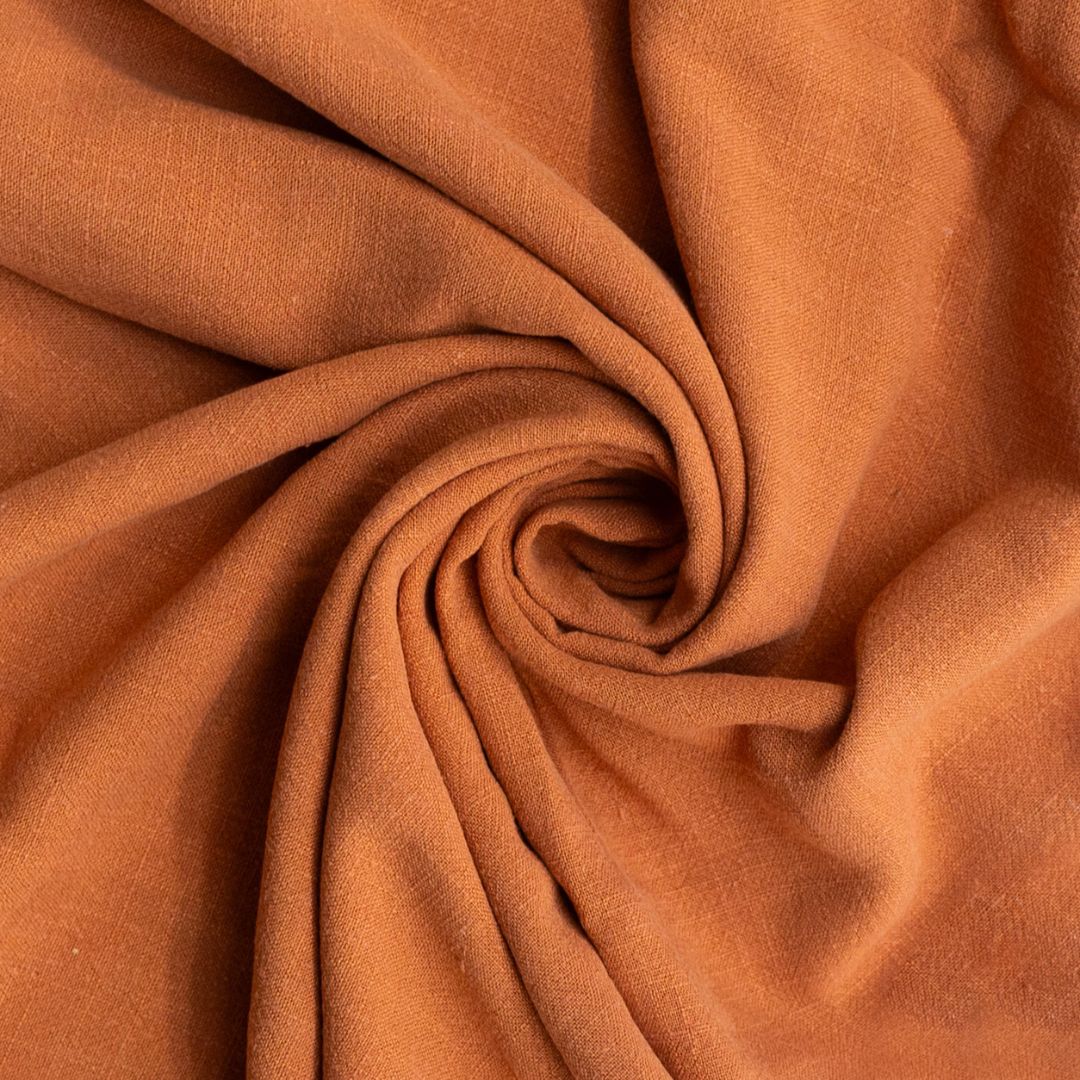 Close-up of brown fabric with a swirl pattern
